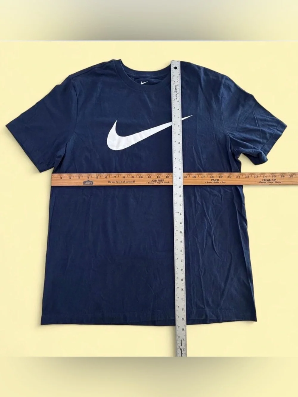 Nike Navy Short-Sleeve Tee with White Swoosh.